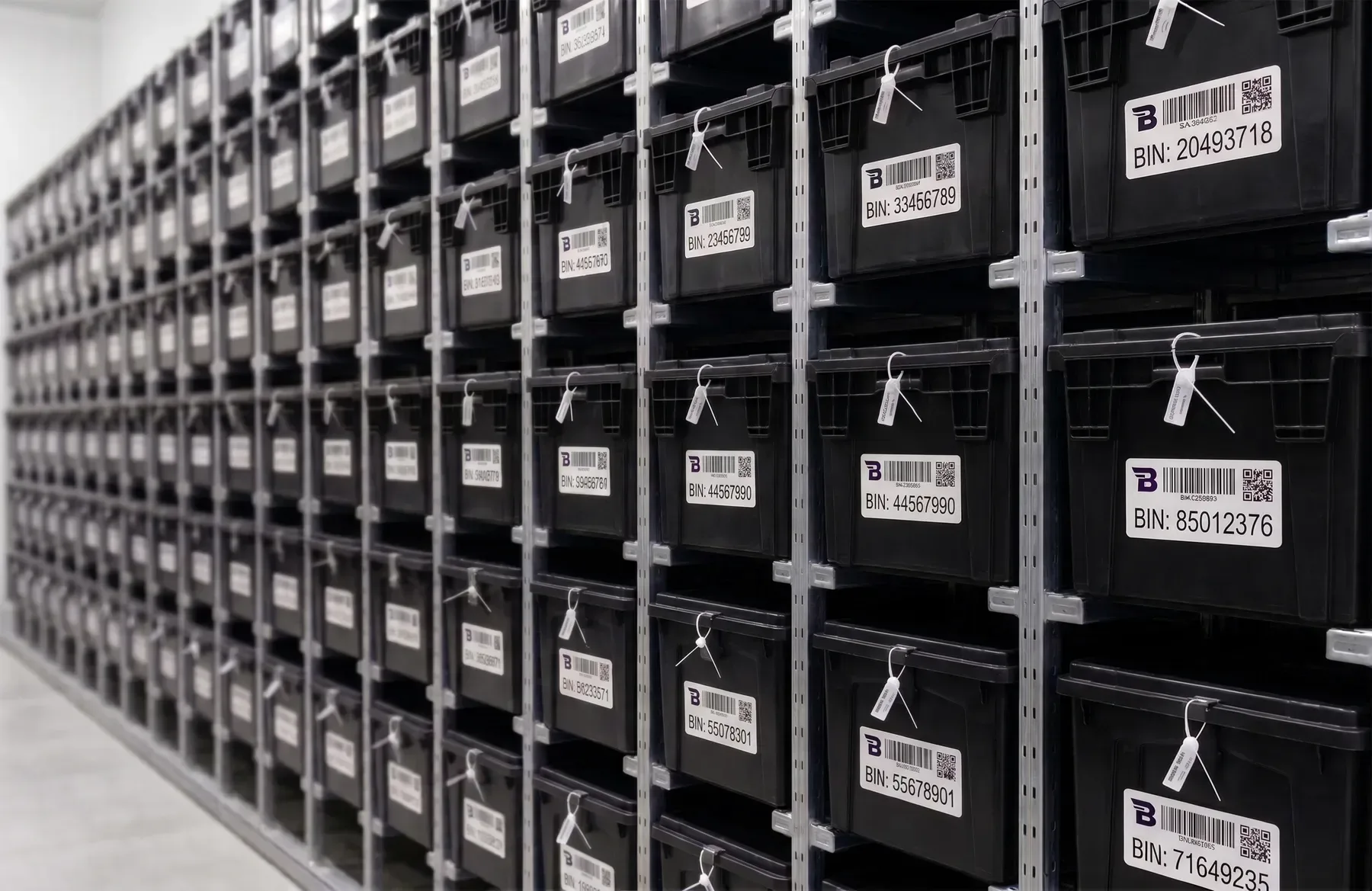 Rows of Binnit bins in individual warehouse rack positions
